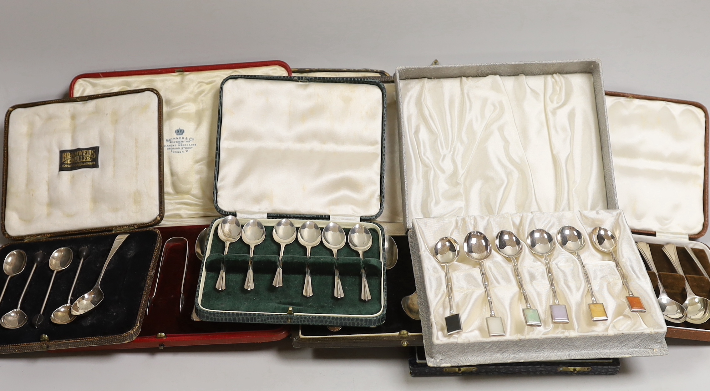 Seven various cased part sets of silver cutlery to include teaspoons etc., together with a cased set of six sterling silver faux bamboo coffee spoons with semi-precious stone tablet inset terminals.